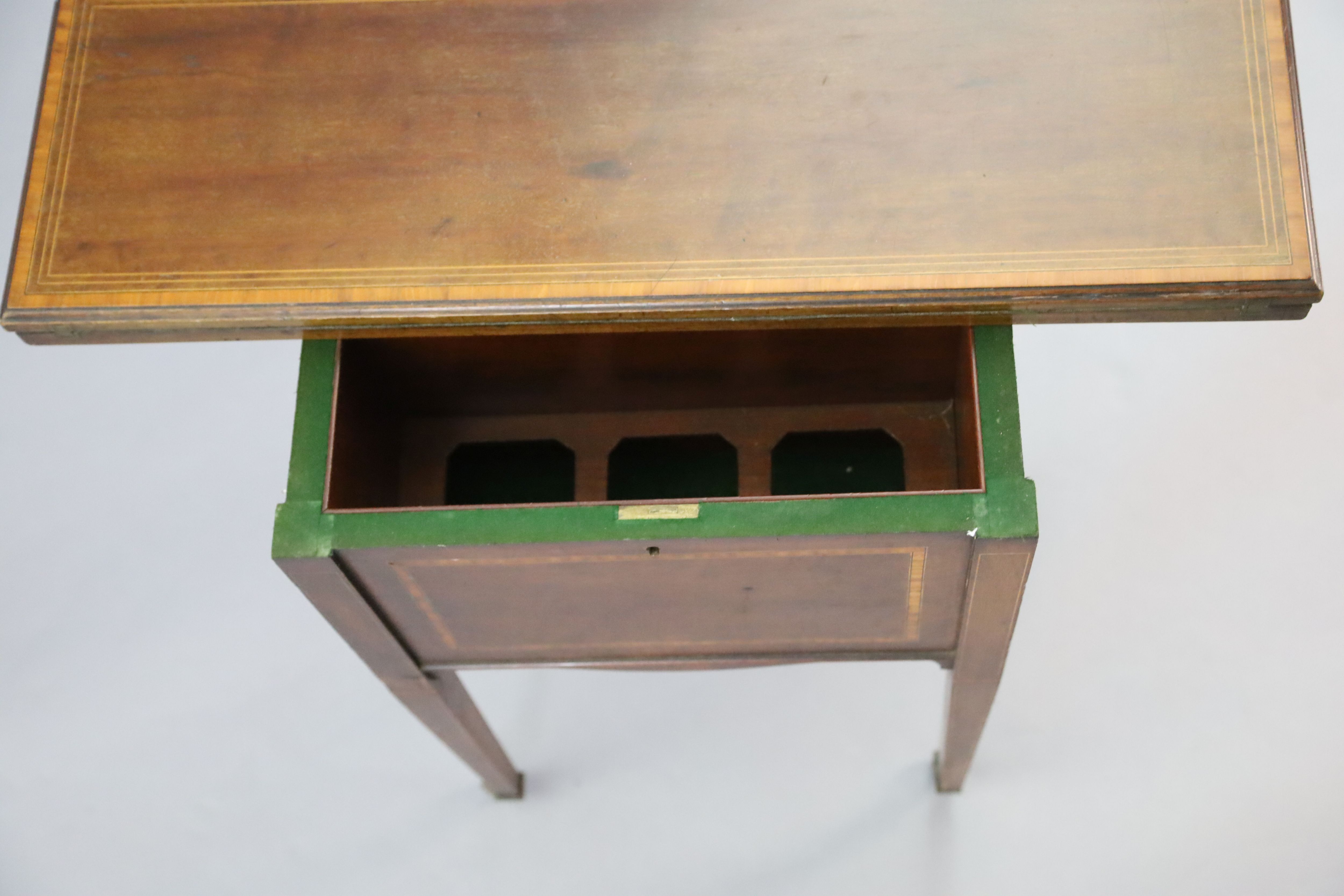 An Edwardian satinwood banded mahogany games/drinks table,